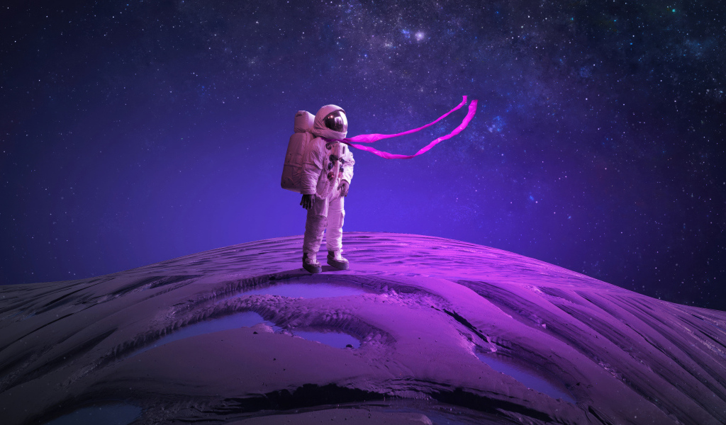 Астронавт стоит на поверхности планеты