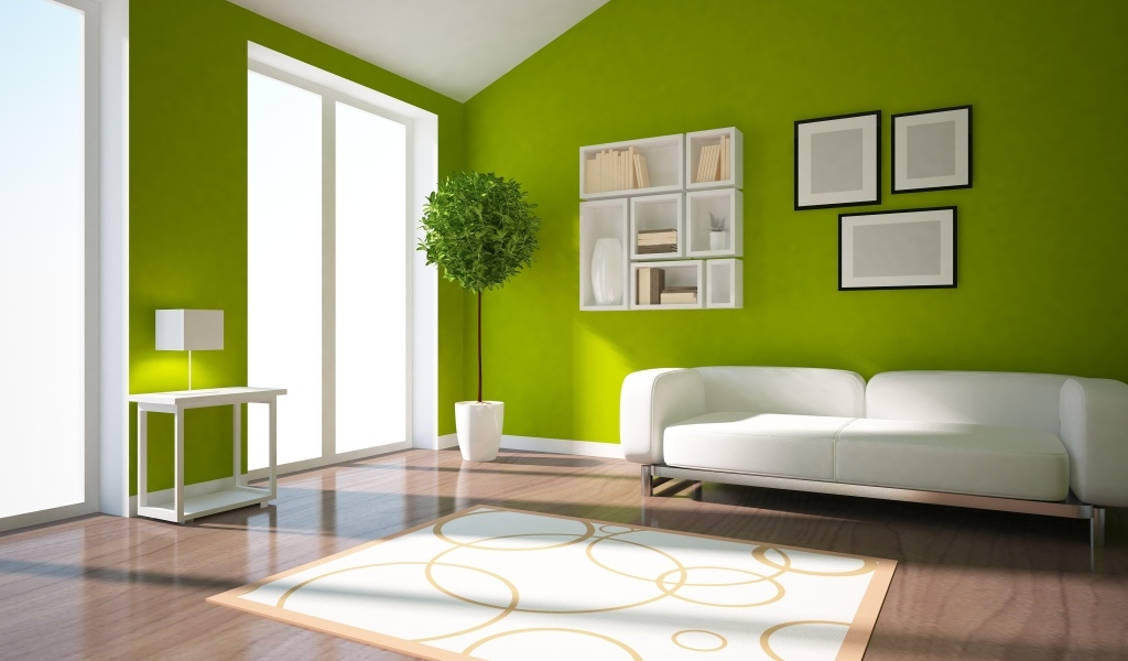 Зеленые стены в гостиной комнате с белым диваном