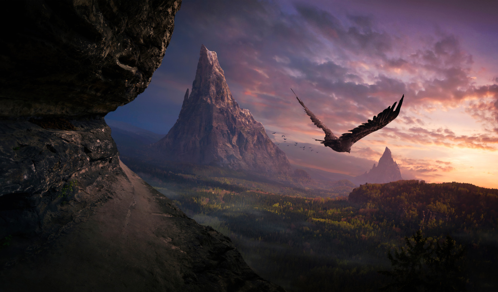 Большой орел летит над горами на закате