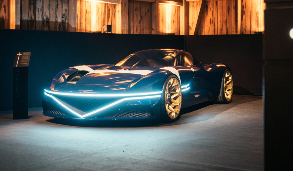 Автомобиль Genesis X Gran Berlinetta Tribute 2024 года с включенными фарами