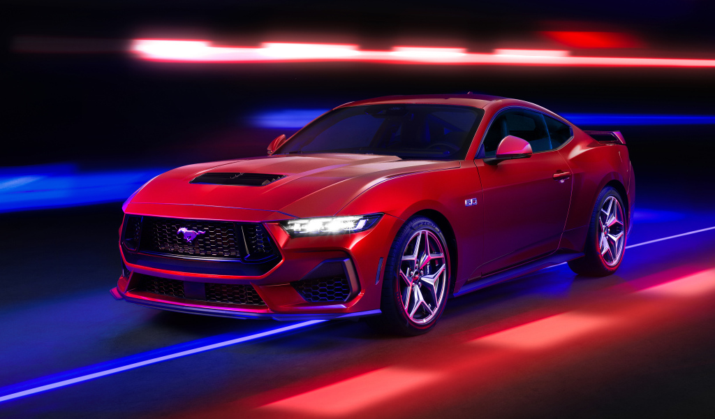 Красный автомобиль Ford Mustang GT Performance 2024 года на черном фоне