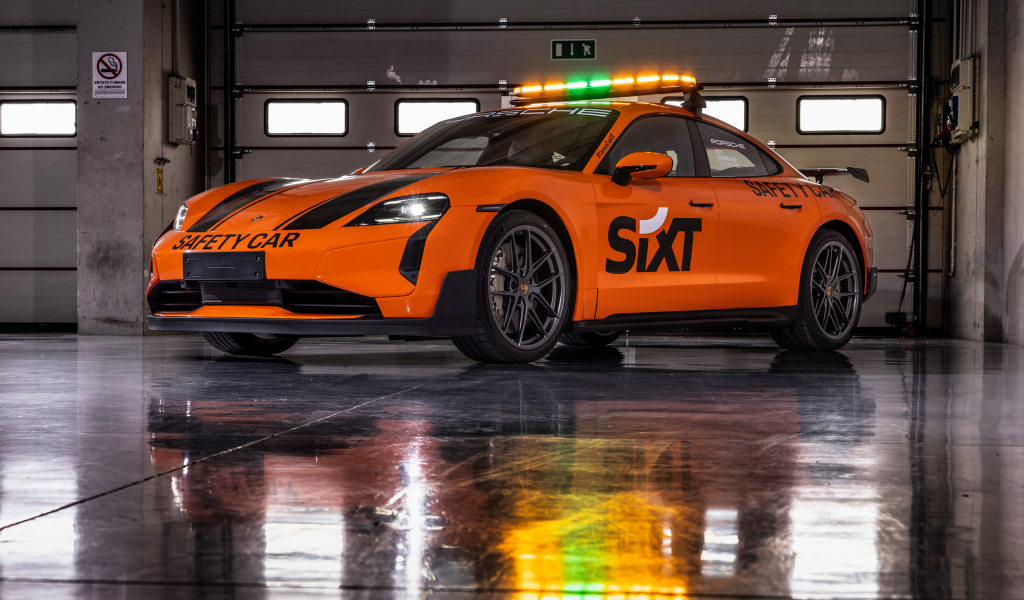 Оранжевый автомобиль Porsche Taycan Turbo GT SIXT Carrera Cup Deutschland Safety Car 2024 года