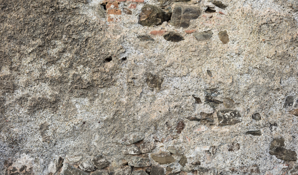 Старая текстурированная стена из цемента и кирпича для фона