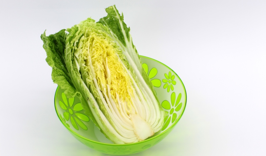 Beijing cabbage in a bowl on a gray background