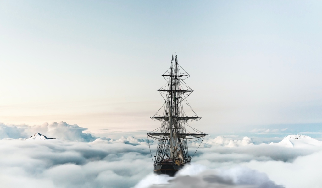 Большой парусный корабль плывет по облакам