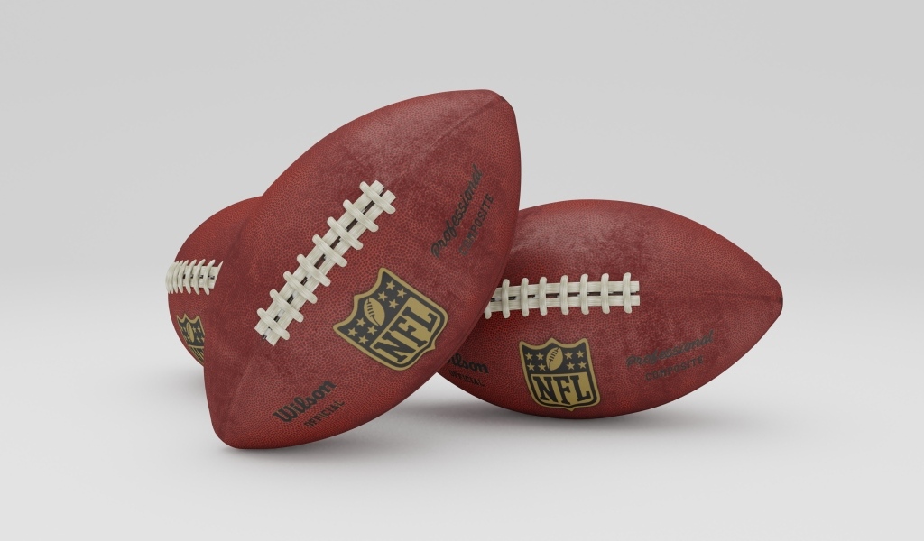 Два мяча для игры американский футбол на сером фоне