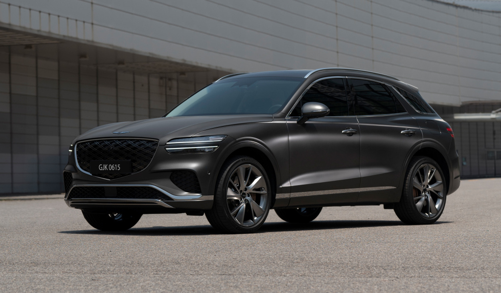 Серый автомобиль Genesis GV70 2024 года