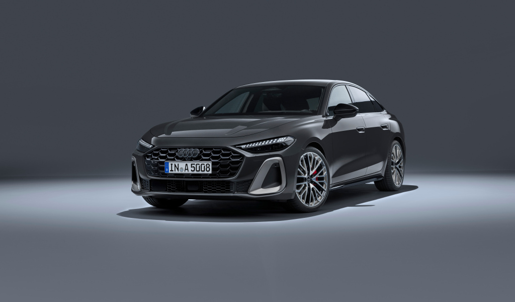 Автомобиль Audi A5 TFSI quattro S line 2024 года на сером фоне