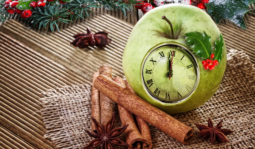 Зеленое яблоко с часами на столе со специями