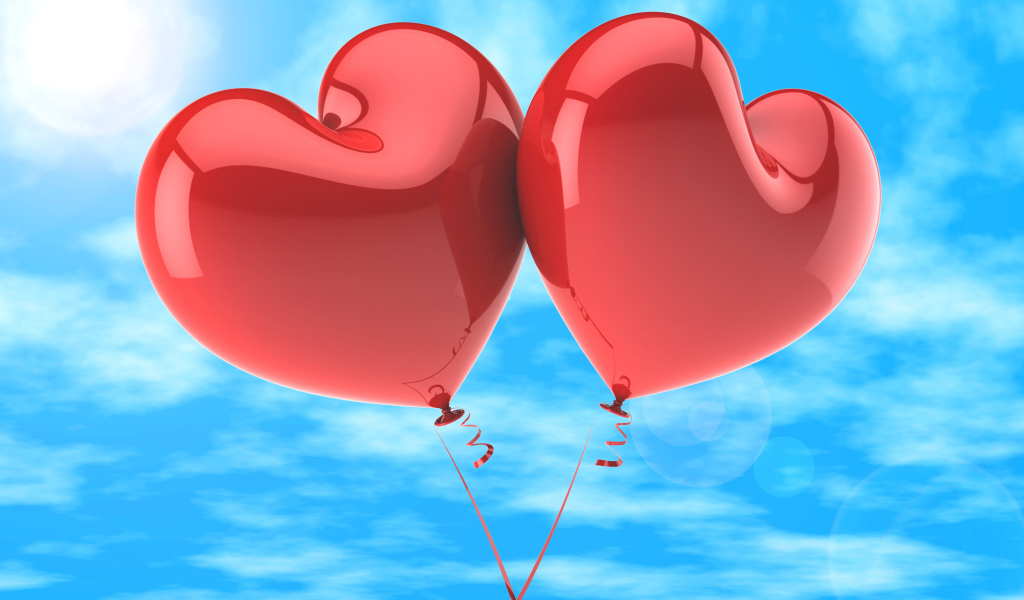 Два красных шарика в форме сердца в голубом небе