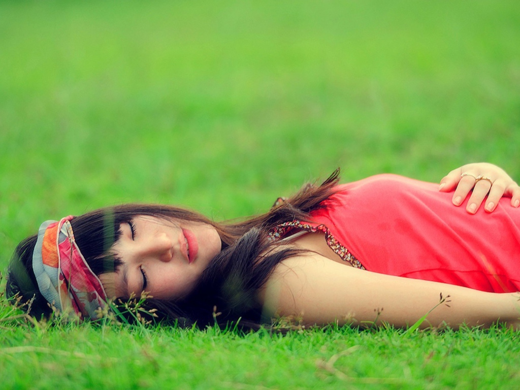 Girl lying on the grass