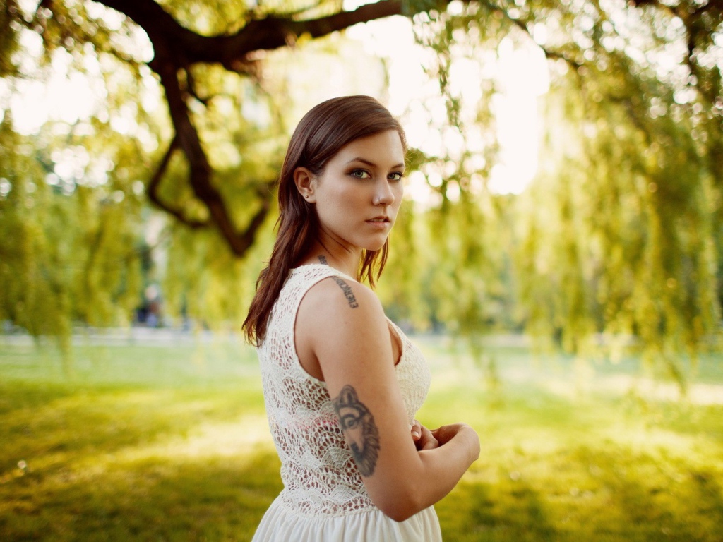 Brunette with tattoo on nature