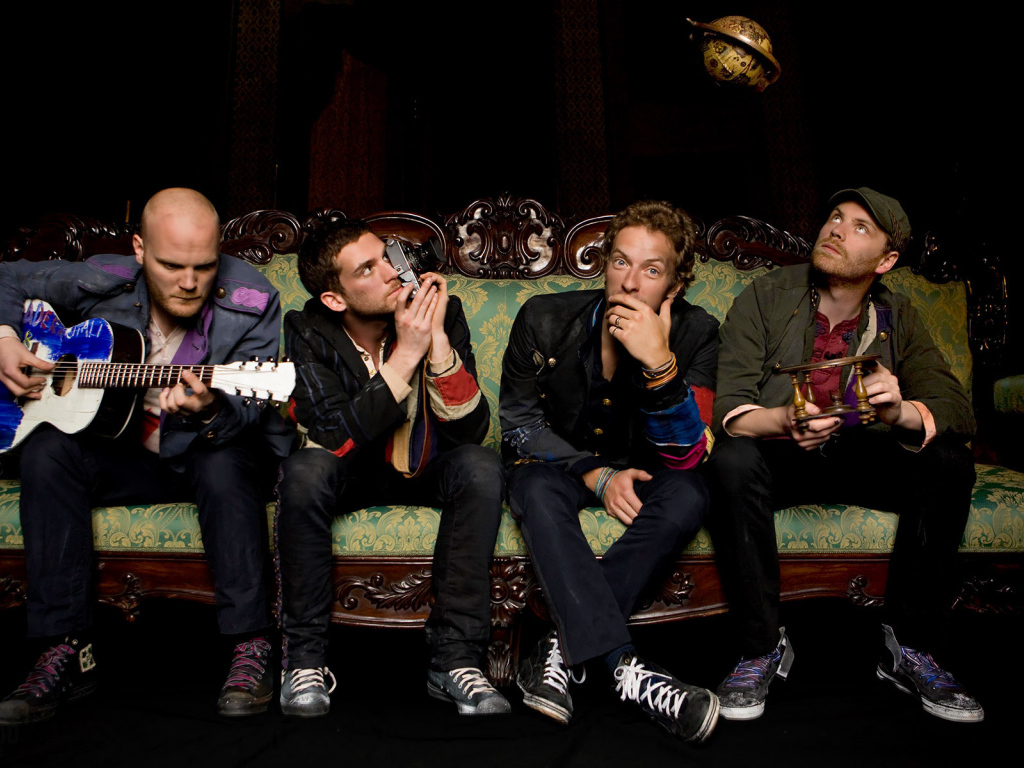Coldplay sitting on the couch
