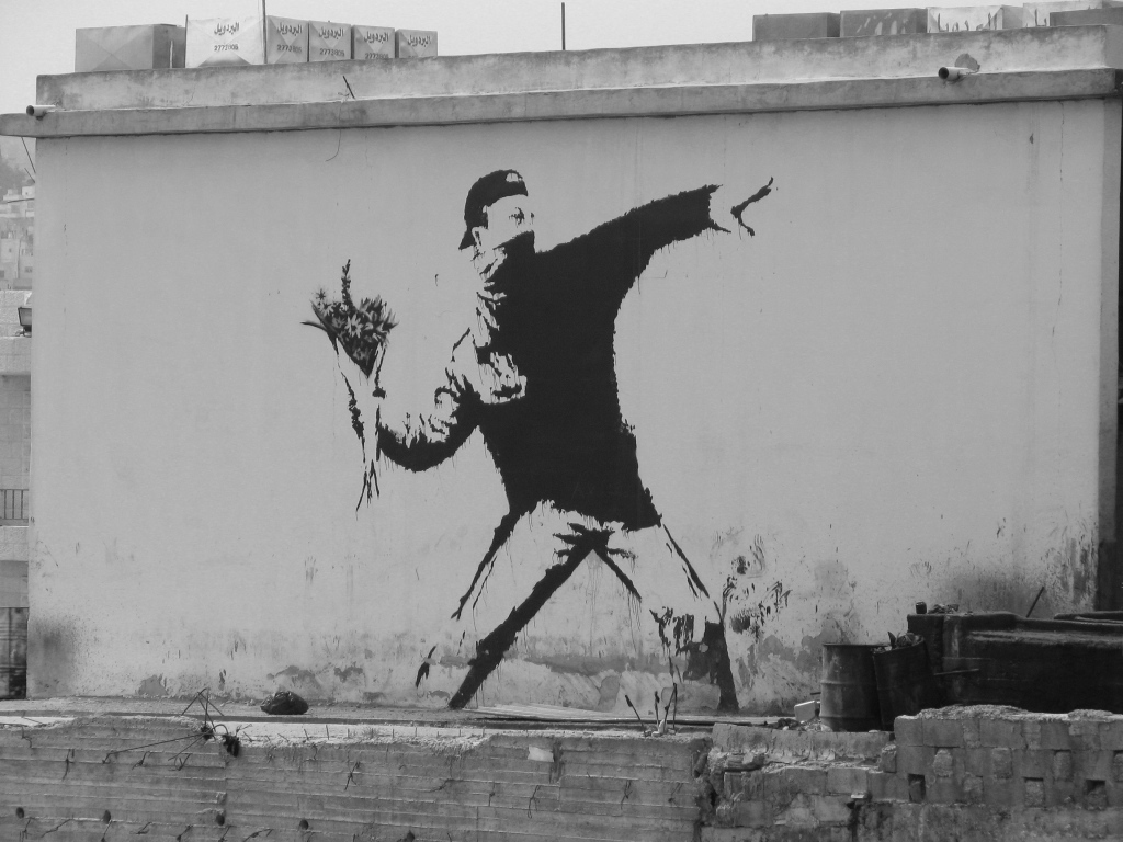 Graffiti, a bouquet of flowers, the artist Banksy