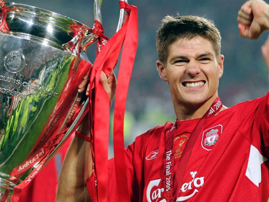 The football player of Liverpool Steven Gerrard with his own trophy
