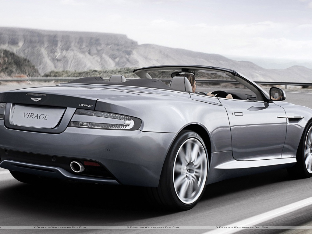 Автомобиль Aston Martin virage на дороге