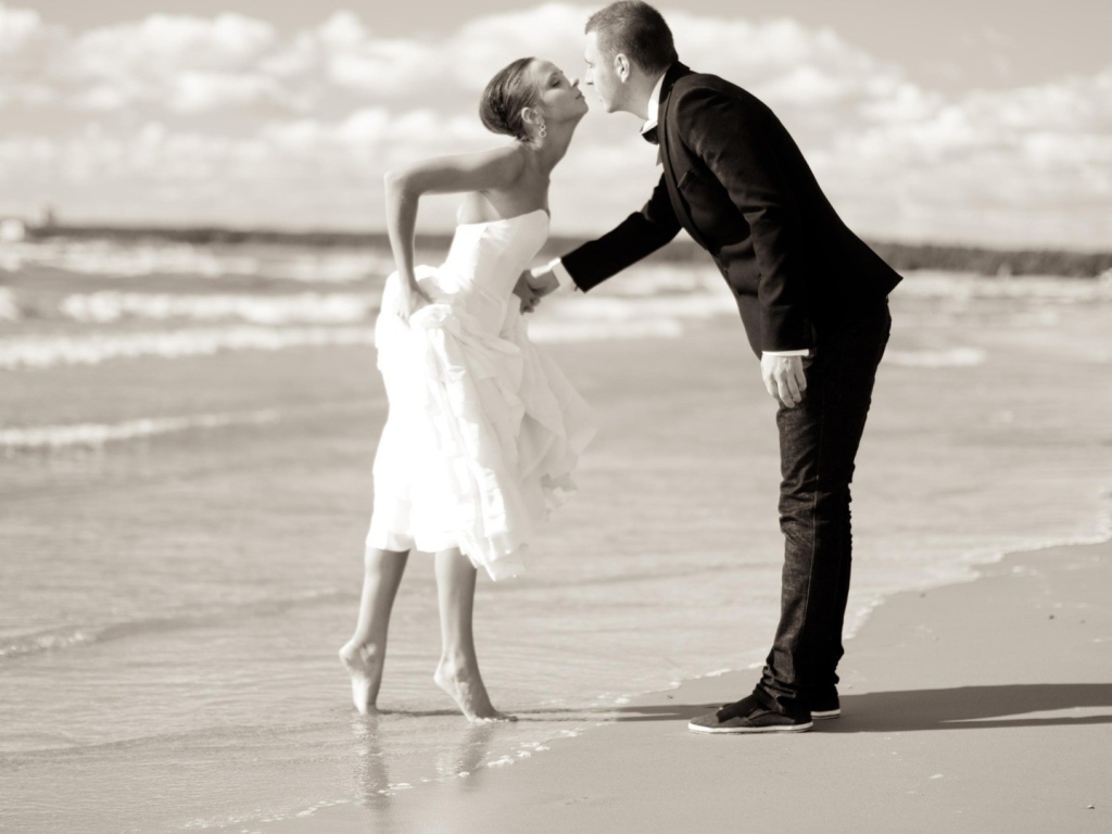 	  Kiss the groom and the bride on the beach
