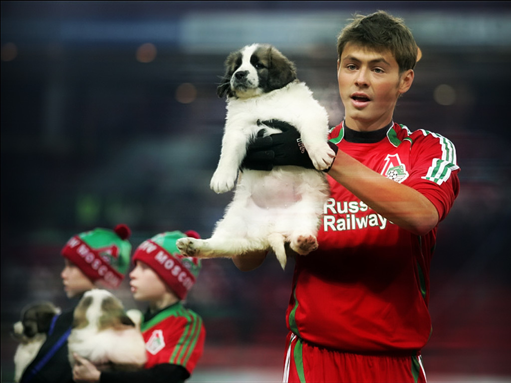 Footballer Diniyar Bilyaletdinov with a dog