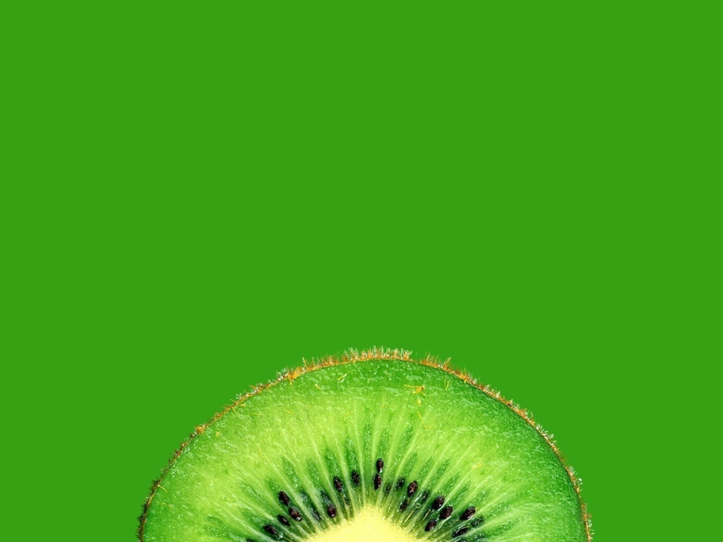Ломтик киви, зеленый фон