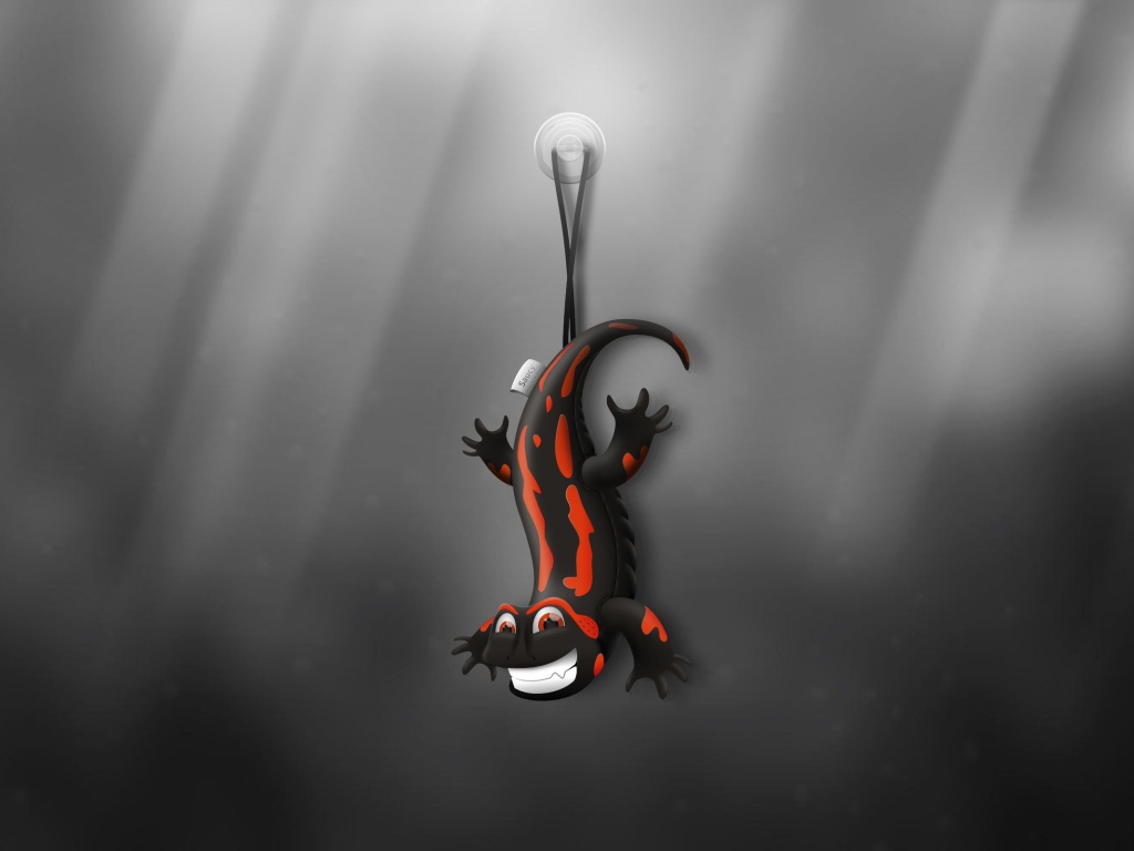 Ящерица игрушка, серый фон