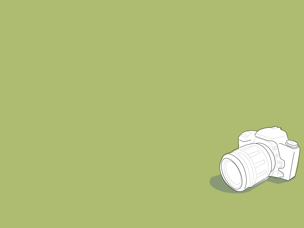 Белый фотоаппарат, зеленый фон