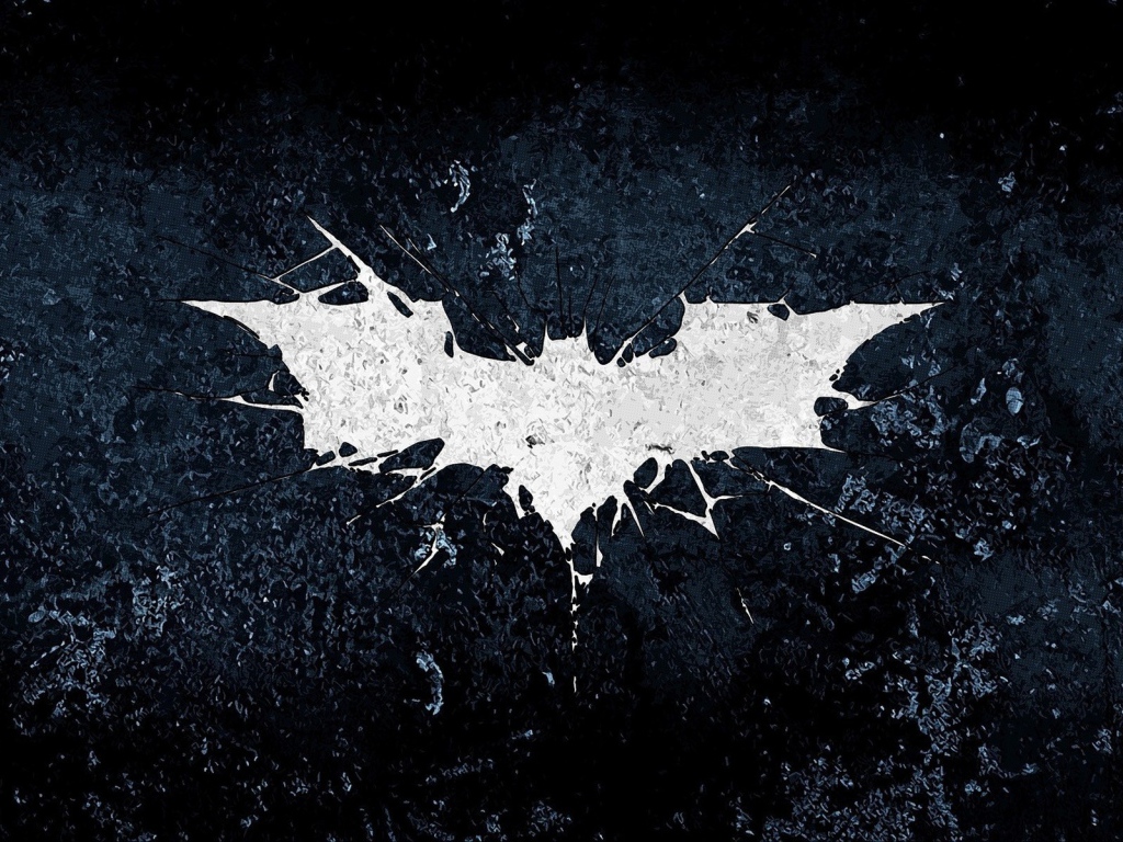 Белый символ летучей мыши на черном фоне