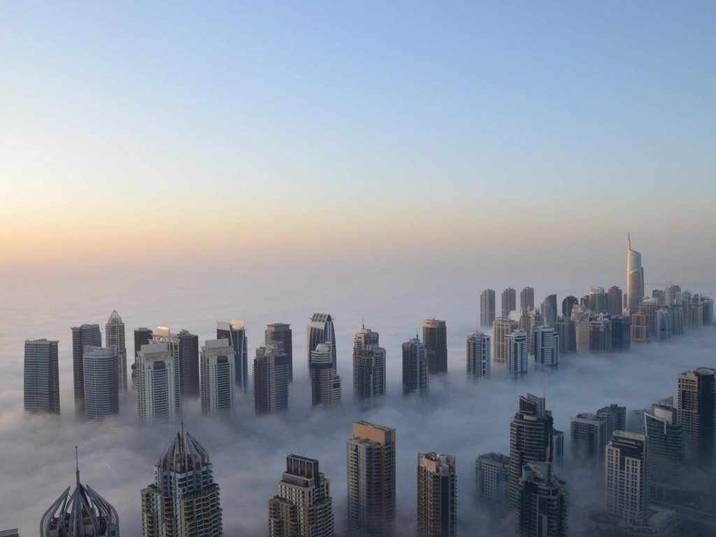 	   The city of Dubai in the clouds
