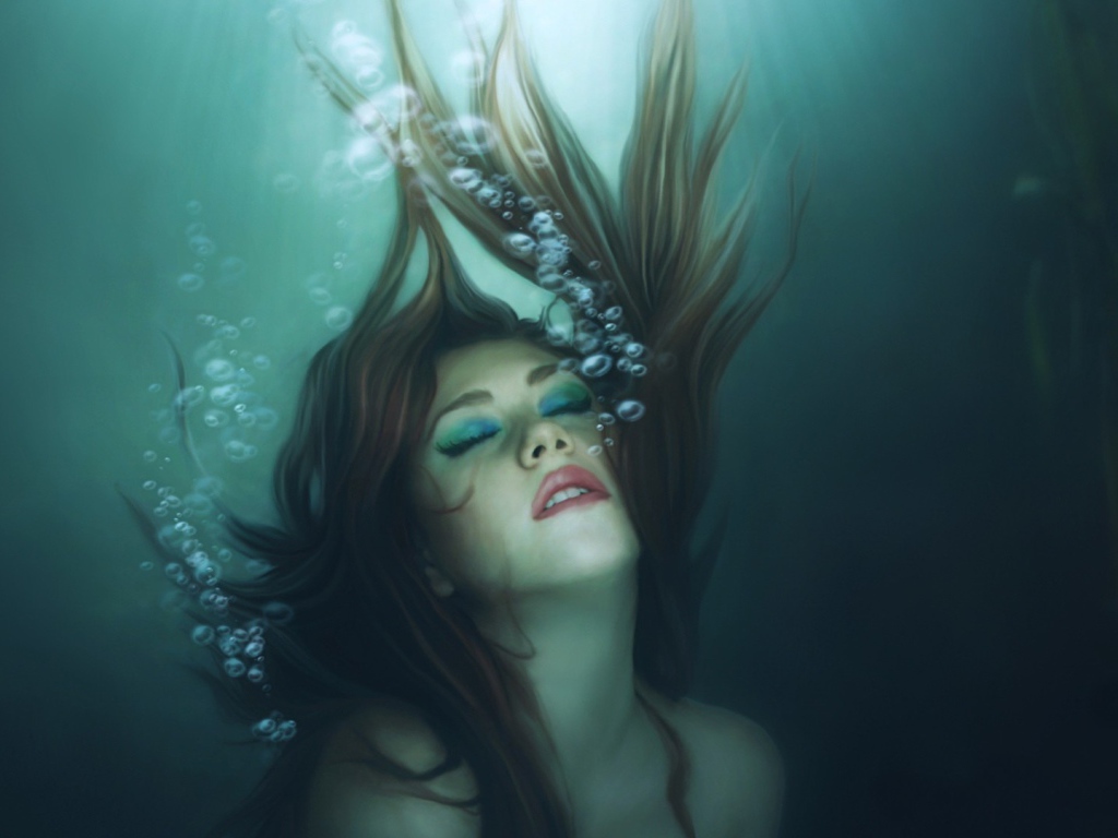 Девушка русалка погружается в воду