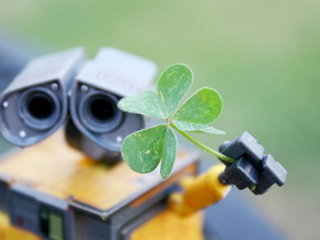 Робот Валли подает зеленый росток