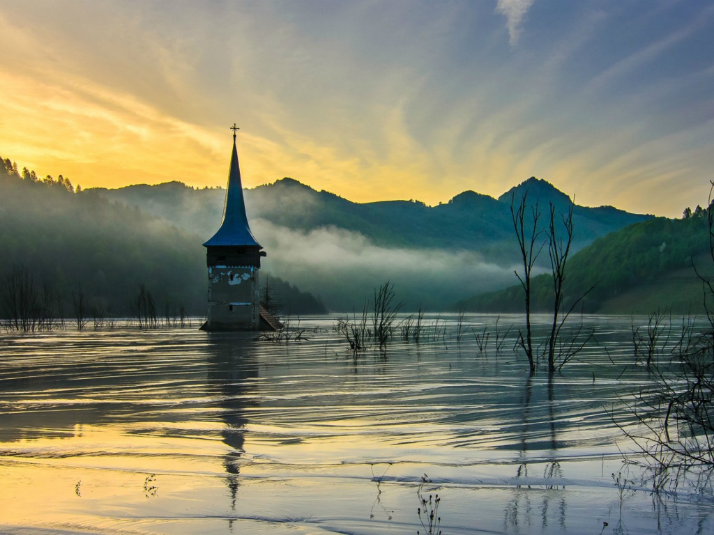 Flooded church at dawn. Romania