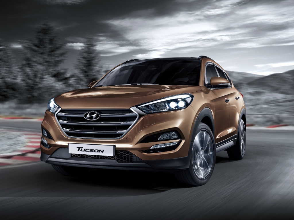 Автомобиль Hyundai Tucson коричневого цвета 