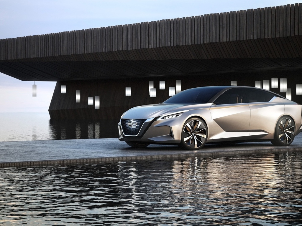 Серебристый автомобиль Nissan Vmotion 2.0 Concept, 2017 у воды 