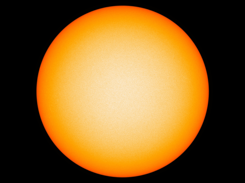 Яркое желтое солнце на черном фоне