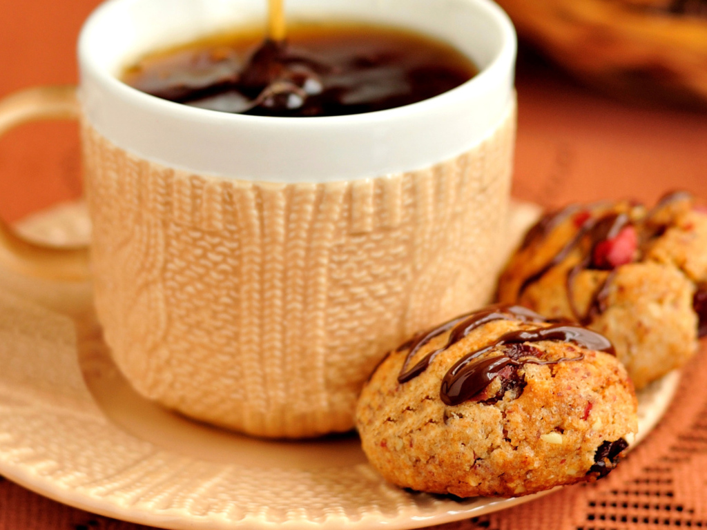 Chocolate cookies on the table with a cup of tea