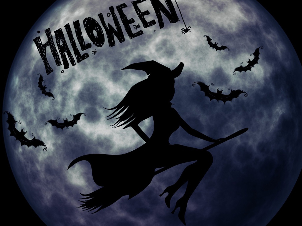 Ведьма на метле на фоне луны на праздник Хэллоуин, 31 октября