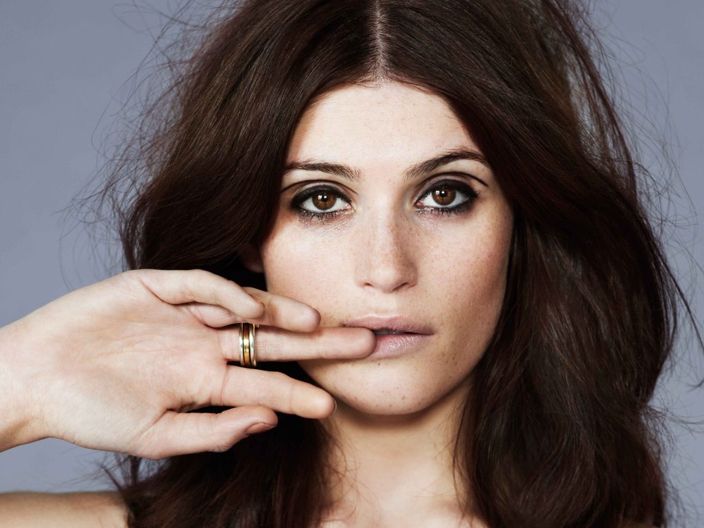 British actress Gemma Arterton with a hand in the face