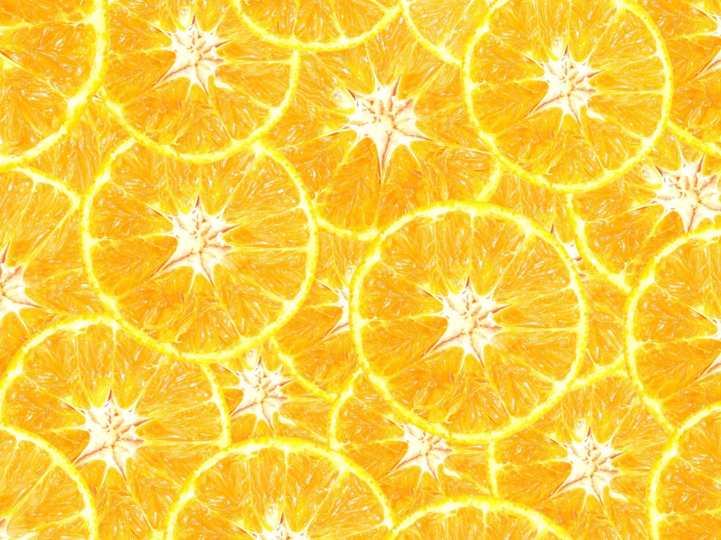 Оранжевый фон из кусочков апельсина крупным планом