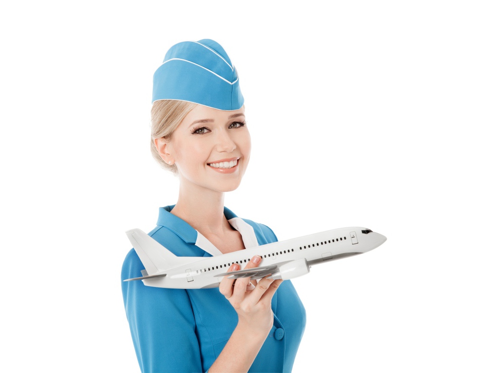 Девушка стюардесса с самолетом в руке на белом фоне