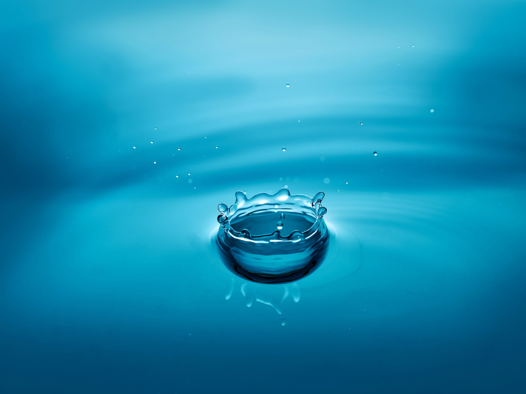 A drop of water in the blue surface