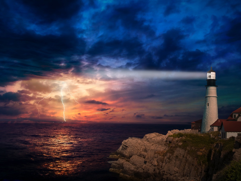 A lighthouse by the sea illuminates a stormy sky