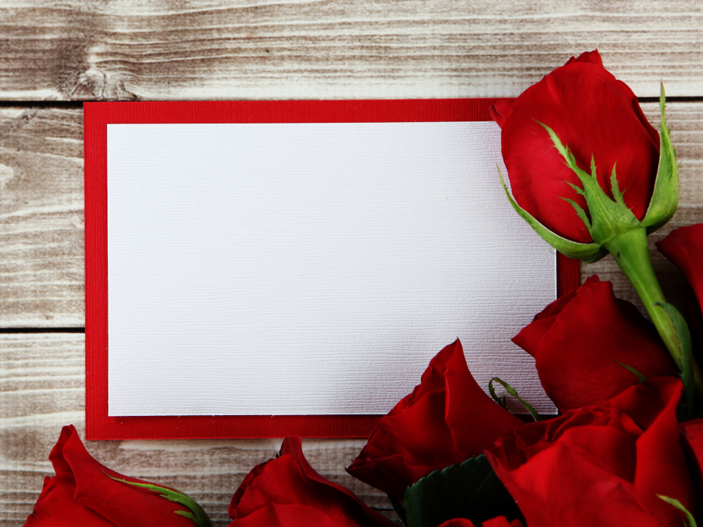Bouquet of roses with a sheet of paper in the background frame for a greeting card