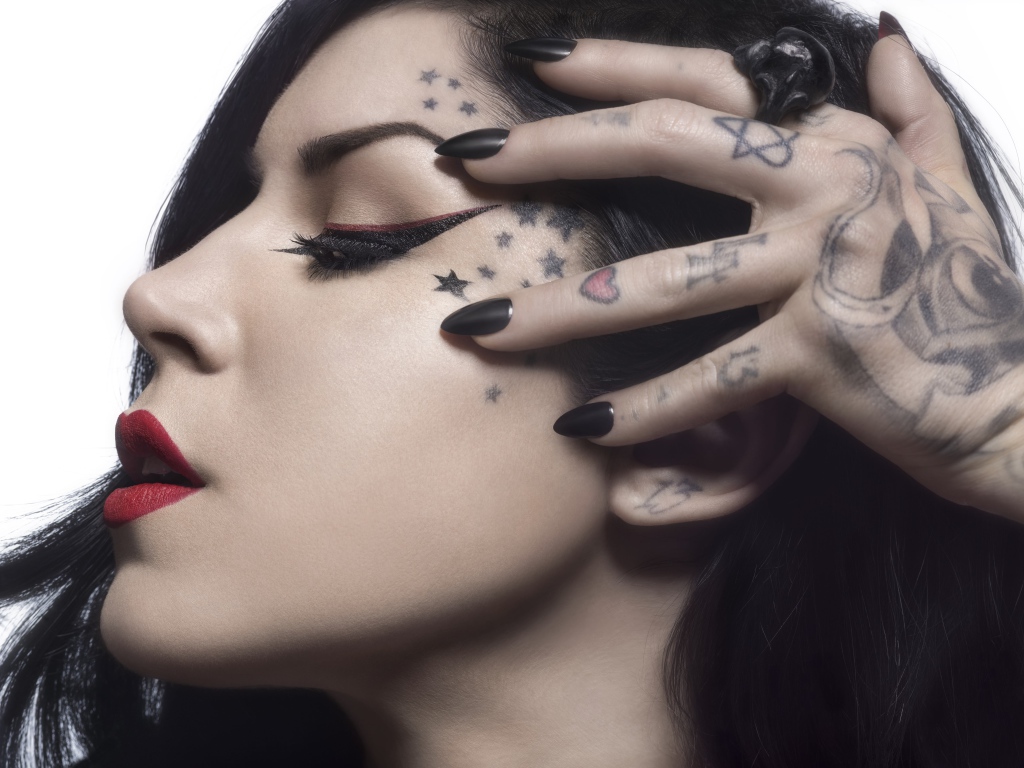 Beautiful girl with tattoos on the body of Kat Von D