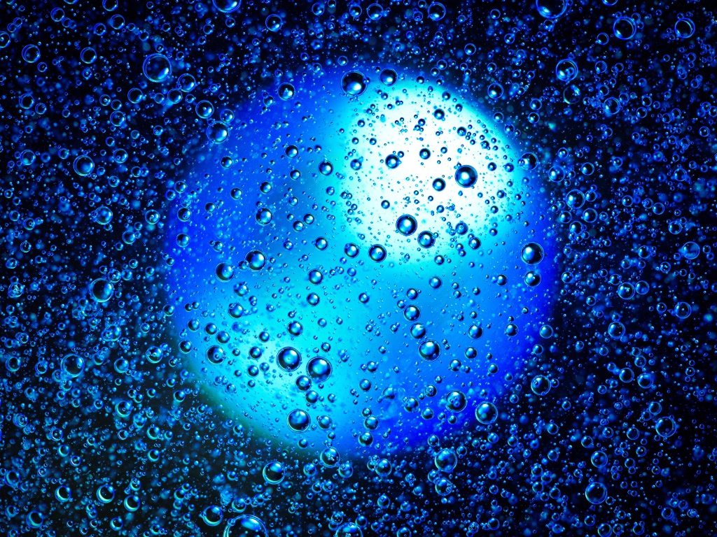 Blue ball in water with bubbles