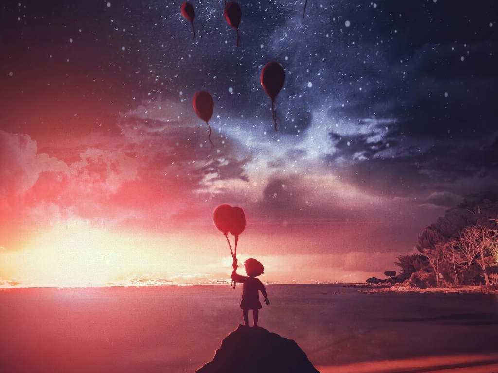 Маленький мальчик запускает в ночное небо воздушные шары на берегу реки