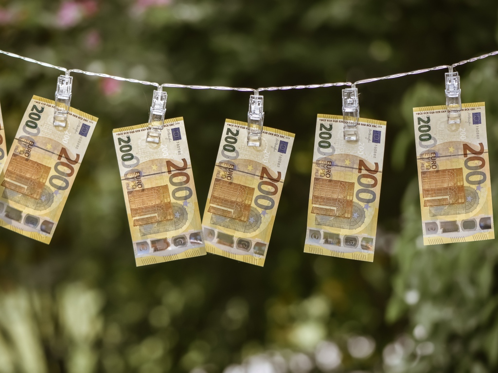 Two hundred euro banknotes dry on a rope