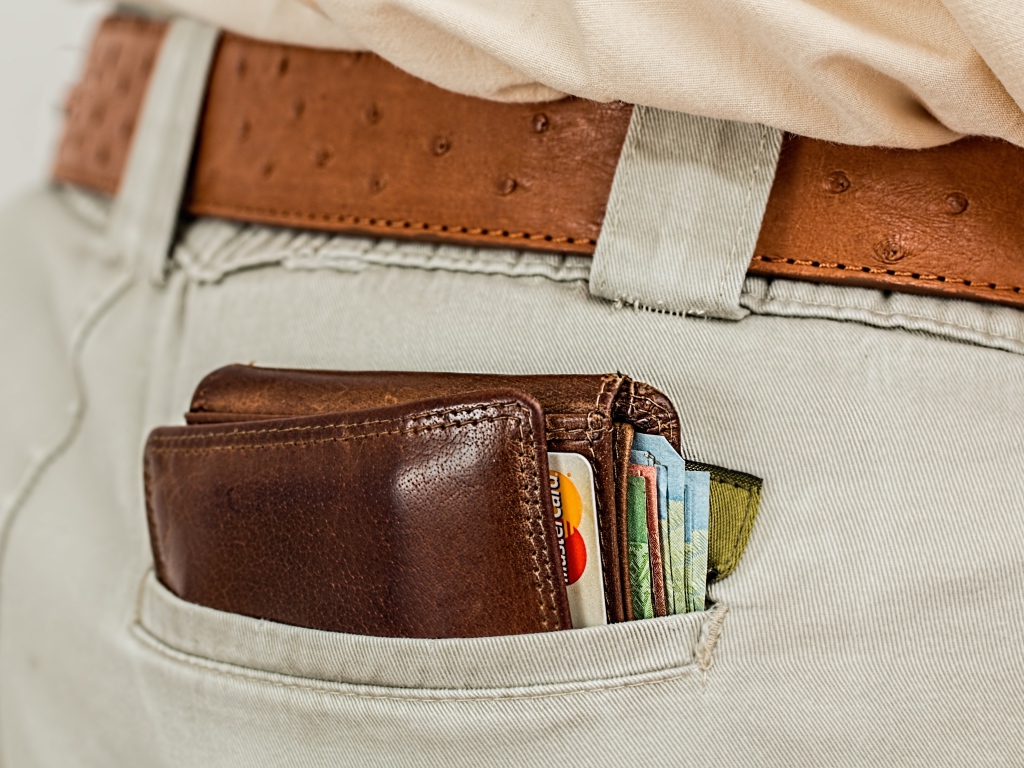 Wallet with money and cards in your trouser pocket
