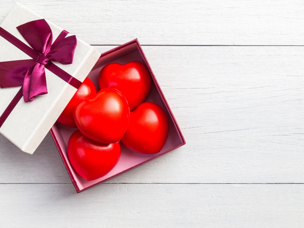 Red hearts in a box on a gray background