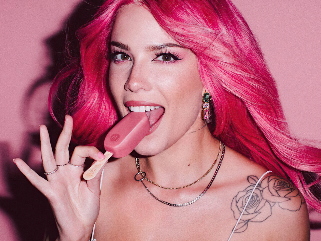 Singer Halsey Magnum with pink hair with ice cream in her hand