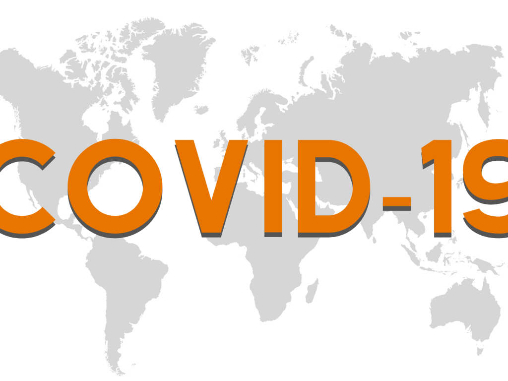 Большая надпись COVID 19 на фоне карты 