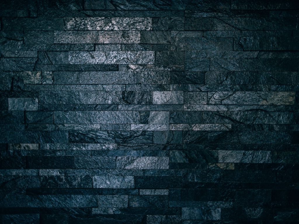 Черная гранитная стена крупным планом 